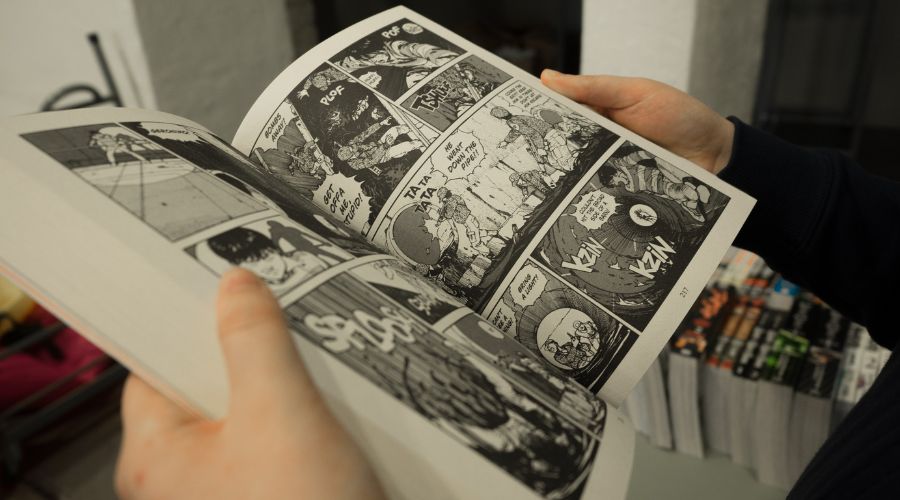 Man reads a comic book.