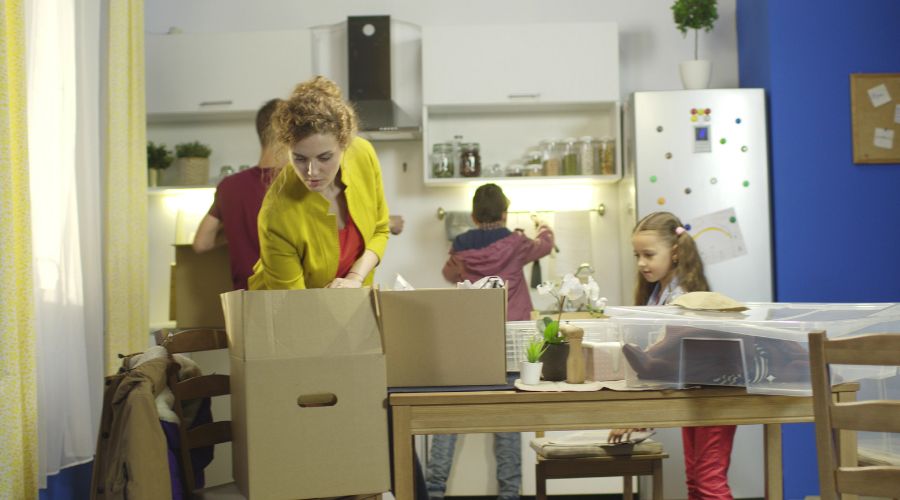 Family unpacking a kitchen